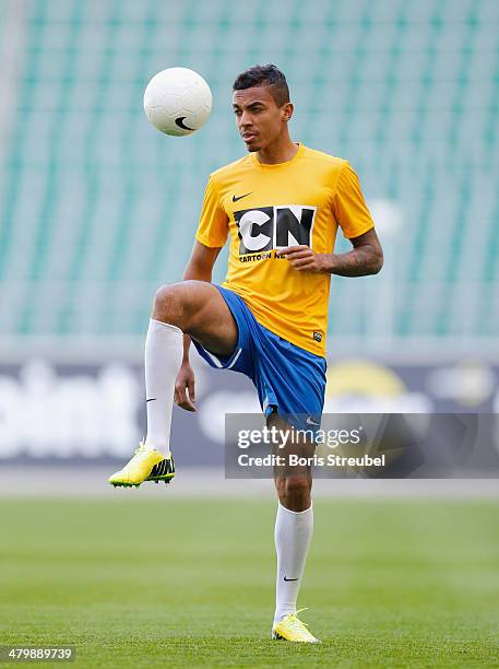 Luiz Gustavo attends a shoot for Cartoon Network's competition 'Cartoon Network Academy 2014' at the VfL Wolfsburg Volkswagen Arena on March 20, 2014...