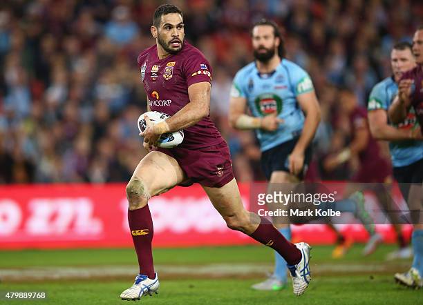 Greg Inglis of the Maroons makes a break during game three of the State of Origin series between the Queensland Maroons and the New South Wales Blues...