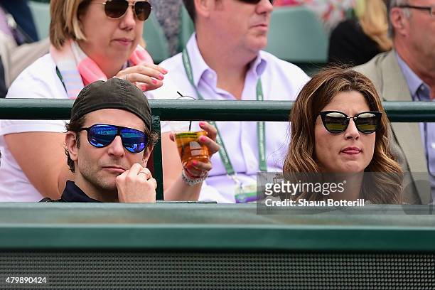 Bradley Cooper and Mirka Federer during day nine of the Wimbledon Lawn Tennis Championships at the All England Lawn Tennis and Croquet Club on July...
