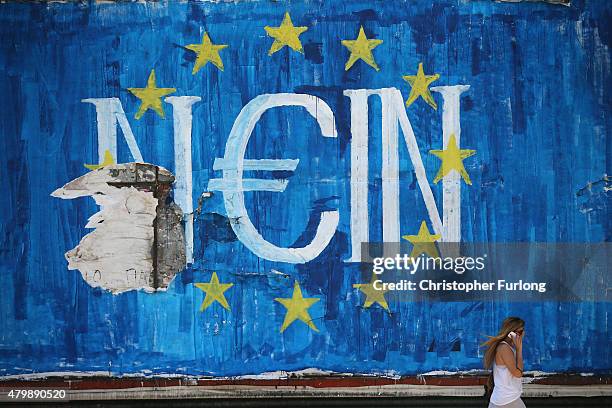 The German word 'Nein' which means 'No' sits on graffiti art displaying the European Union flag and a euro symbol on July 8, 2015 in Athens, Greece....