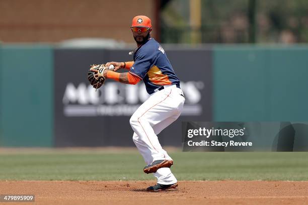 Jonathan Villar of the Houston Astros makes a throw to first base in the first inning of a game against the Philadelphia Phillies at Osceola County...