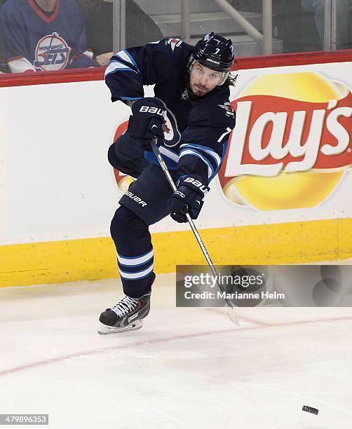 Keaton Ellerby of the Winnipeg Jets passes the puck during third period action in an NHL game against the Vancouver Canucks at the MTS Centre on...