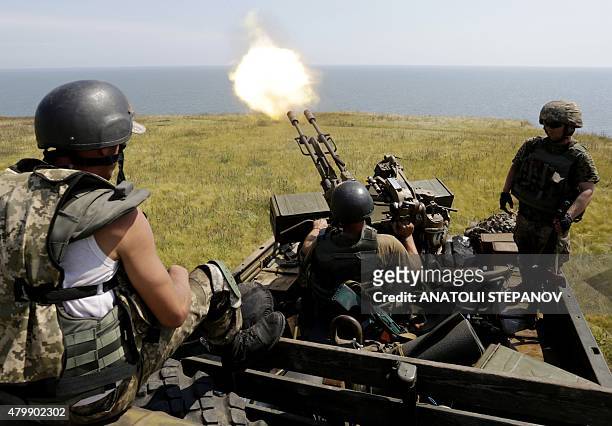 Anti-aircraft gunners of Ukrainian forces take part in exercises not far from southeastern city of Mariupol, Donetsk region on July 7, 2015. Kiev...