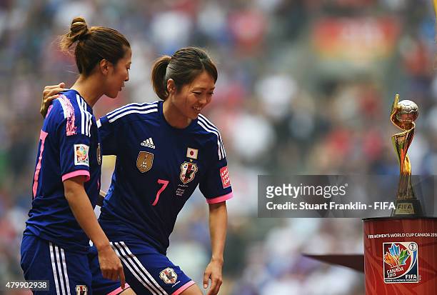 Yugi Ogimi and Kozue Ando of Japan ponder at the FIFA Women's World Cup Final between USA and Japan at BC Place Stadium on July 5, 2015 in Vancouver,...