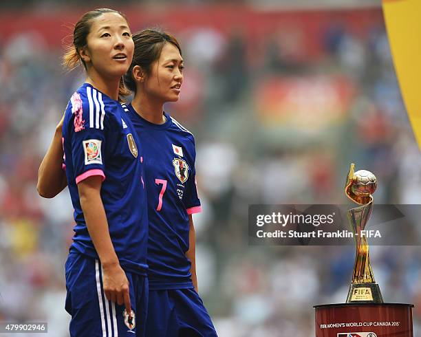 Yugi Ogimi and Kozue Ando of Japan ponder at the FIFA Women's World Cup Final between USA and Japan at BC Place Stadium on July 5, 2015 in Vancouver,...