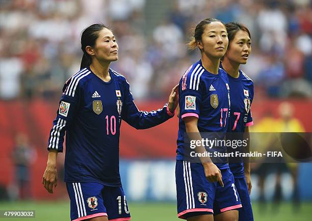 Homare Sawa, Yugi Ogimi and Kozue Ando of Japan ponder at the FIFA Women's World Cup Final between USA and Japan at BC Place Stadium on July 5, 2015...