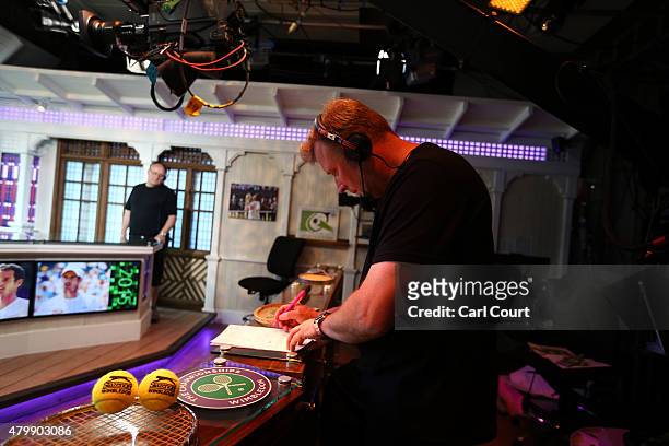 Floor manager works in an ESPN studio as broadcast journalist Chris McKendry prepares to present an update on day 9 of the Wimbledon Lawn Tennis...
