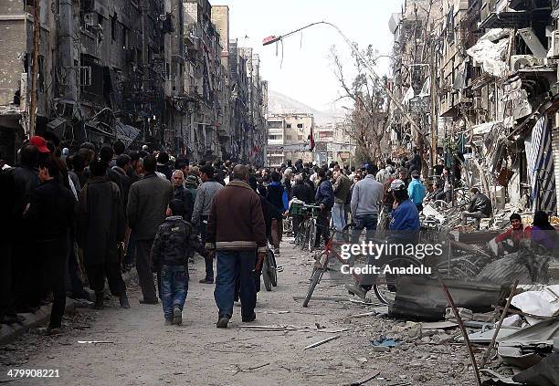 The United Nations Relief and Works Agency for Palestine Refugees in the Near East delivers humanitarian aid packages to the Yarmouk refugee camps in...