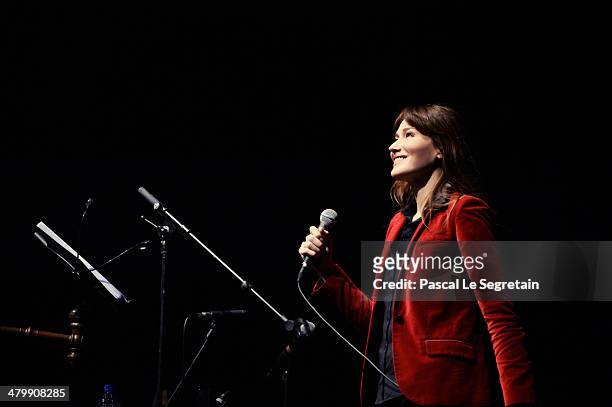Carla Bruni performs on stage at L'Olympia on March 11, 2014 in Paris, France.