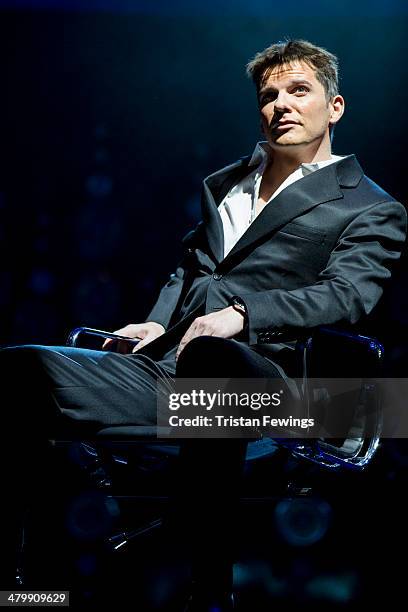 Nigel Harman as Simon Cowell during a photocall for "I Can't Sing! The X Factor Musical" at London Palladium on March 21, 2014 in London, England.