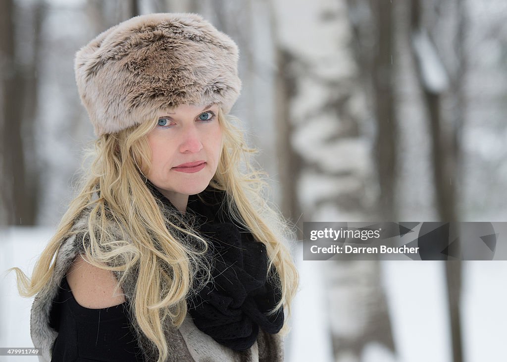 Blonde woman in faux fur hat