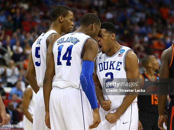 Quinn Cook, Rasheed Sulaimon and Rodney Hood of the Duke Blue Devils celebrate in the second half against the Mercer Bears in the second round of the...