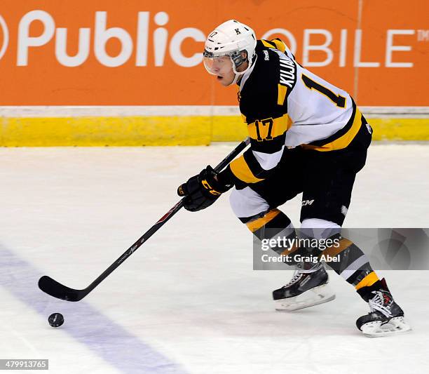 Ryan Kujawinski of the Kingston Frontenacs skates up ice against the Mississauga Steelheads during game action on March 16, 2014 at the Hershey...