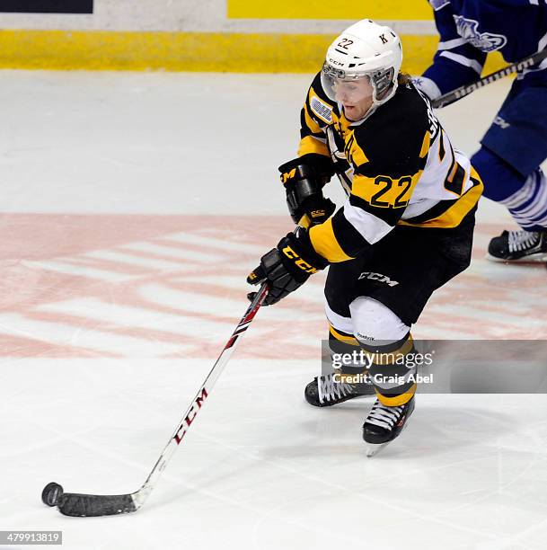 Darcy Greenaway of the Kingston Frontenacs controls the puck against the Mississauga Steelheads during game action on March 16, 2014 at the Hershey...
