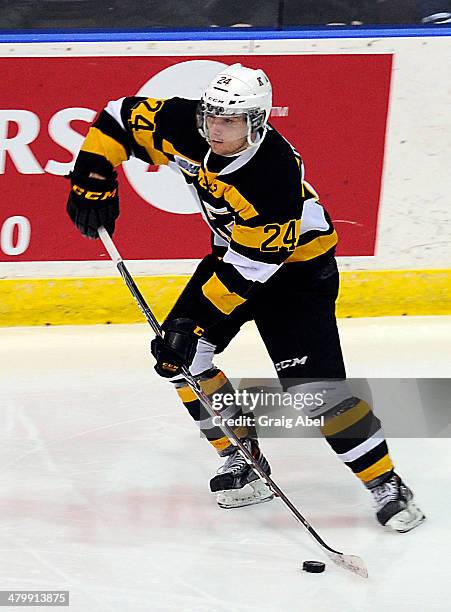 Slater Doggett of the Kingston Frontenacs controls the puck against the Mississauga Steelheads during game action on March 16, 2014 at the Hershey...