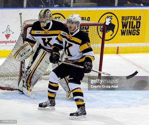 Mikko Valnonen and goalie Lucas Peressini the Kingston Frontenacs guard the crease against the Mississauga Steelheads during game action on March 16,...