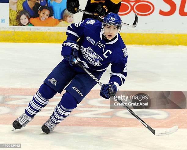 Brett Foy of the Mississauga Steelheads skates up ice against the Kingston Frontenacs during game action on March 16, 2014 at the Hershey Centre in...