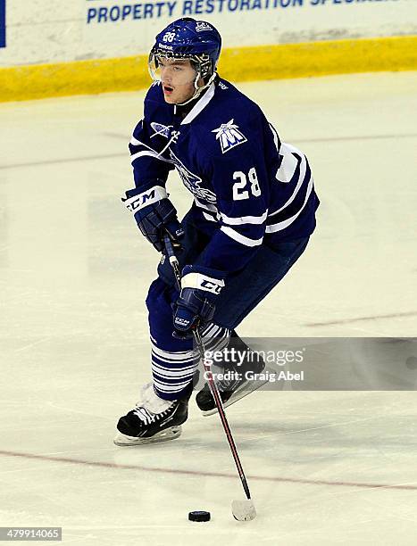 Sean Day of the Mississauga Steelheads controls the puck against the Kingston Frontenacs during game action on March 16, 2014 at the Hershey Centre...