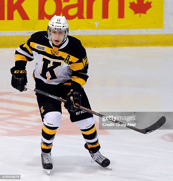 Ryan Kujawinski of the Kingston Frontenacs skates up ice against the Mississauga Steelheads during game action on March 16, 2014 at the Hershey...