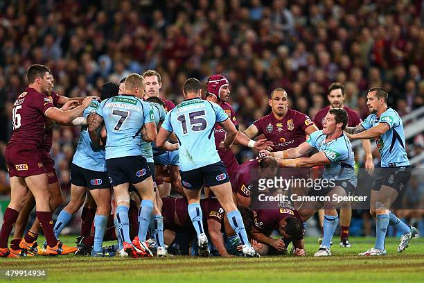 Scuffle breaks out during game three of the State of Origin series between the Queensland Maroons and the New South Wales Blues at Suncorp Stadium on...