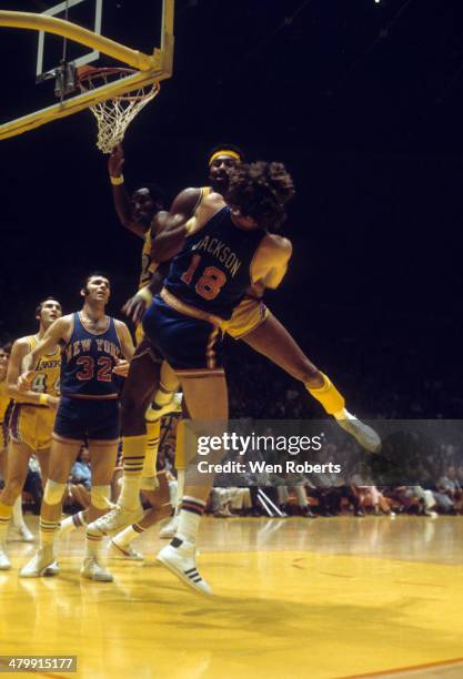 Wilt Chamberlain of the Los Angeles Lakers and Phil Jackson of the New York Knicks fight for the ball circa 1972 at the Forum in Inglewood,...