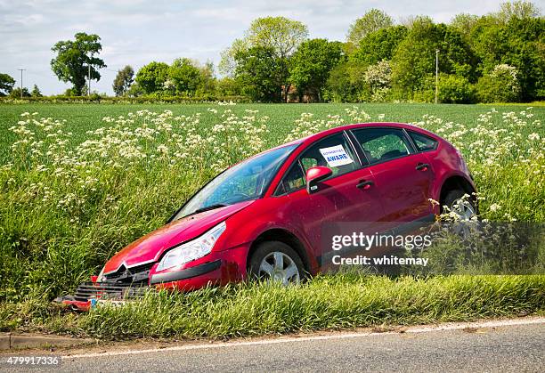 crashed car in a ditch - ditch stock pictures, royalty-free photos & images