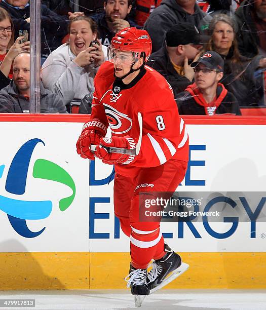 Andrei Loktionov of the Carolina Hurricanes skates for position along the boards during their NHL game against the Buffalo Sabres at PNC Arena on...