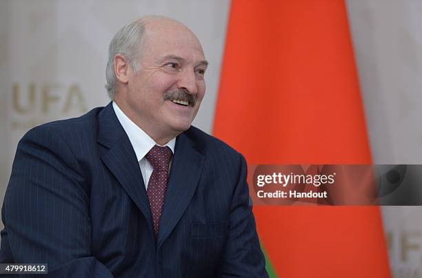 In this handout image supplied by Host Photo Agency / RIA Novosti, President of the Republic of Belarus Alexander Lukashenko meets with President of...