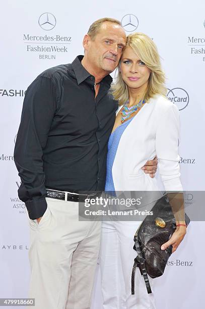 Goetz Elbertzhagen and Lydia attend the Irene Luft show during the Mercedes-Benz Fashion Week Berlin Spring/Summer 2016 at Brandenburg Gate on July...