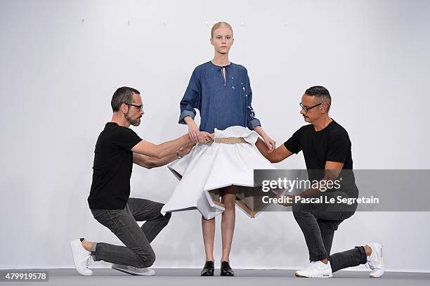 Viktor Horsting, a model and Rolf Snoeren pose on the runway during the Viktor & Rolf show as part of Paris Fashion Week Haute Couture Fall/Winter...