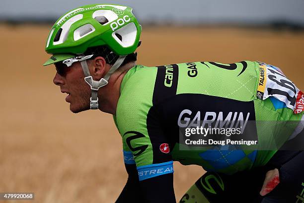 Andrew Talanksy of the United States riding for Cannondale-Garmin exhibits evidence of a crash as he chases at the back of the race during stage five...