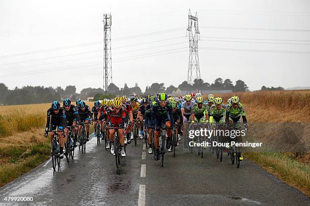 Team Sky, BMC Racing, Movistar and Tinkoff-Saxo ride at the front of the race as rain falls on the peloton during stage five of the 2015 Tour de...