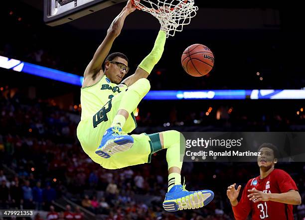 Isaiah Austin of the Baylor Bears dunks in the second half against the Nebraska Cornhuskers during the second round of the 2014 NCAA Men's Basketball...