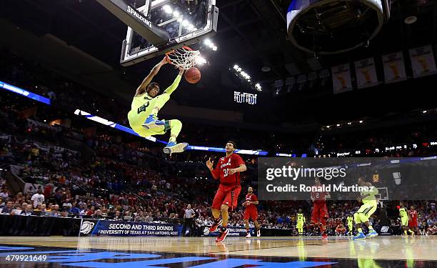 Isaiah Austin of the Baylor Bears dunks in the second half against the Nebraska Cornhuskers during the second round of the 2014 NCAA Men's Basketball...