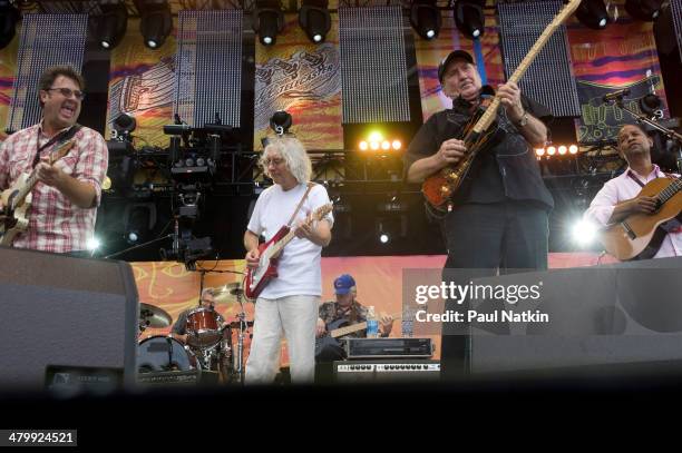 From left, musicians Vince Gill, Albert Lee, James Burton, and Earl Klugh perform onstage at Eric Clapton's Crossroads Guitar Festival, held at...