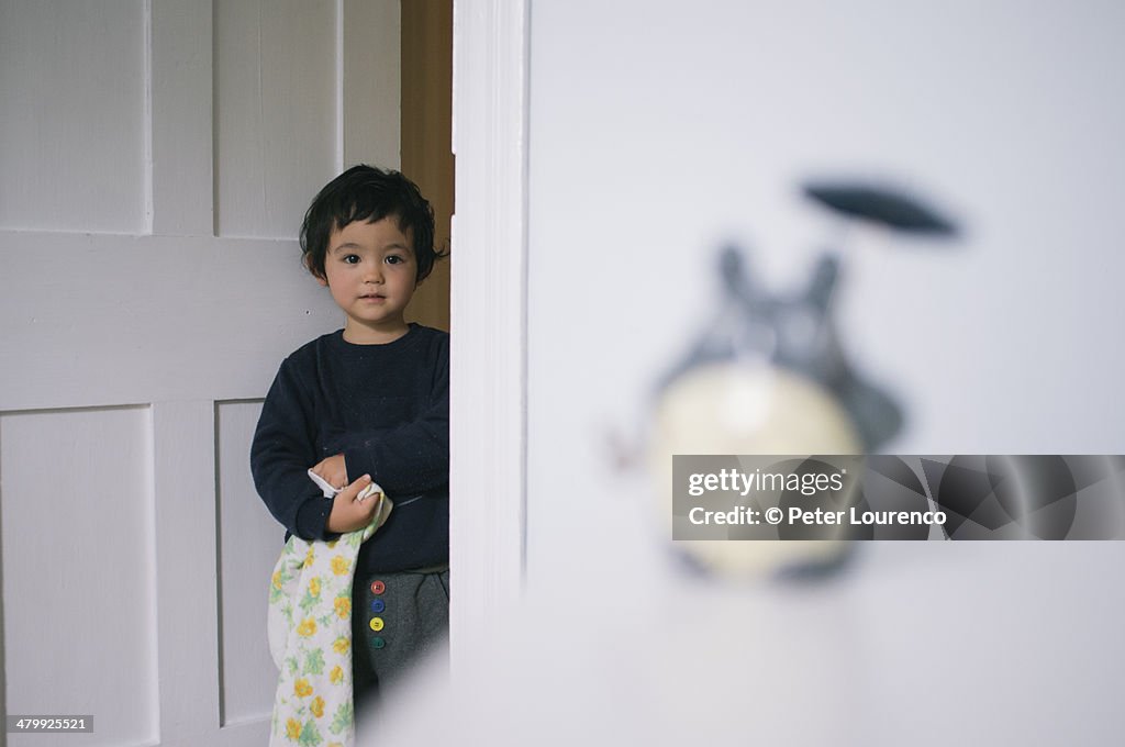 Watching from the doorway.