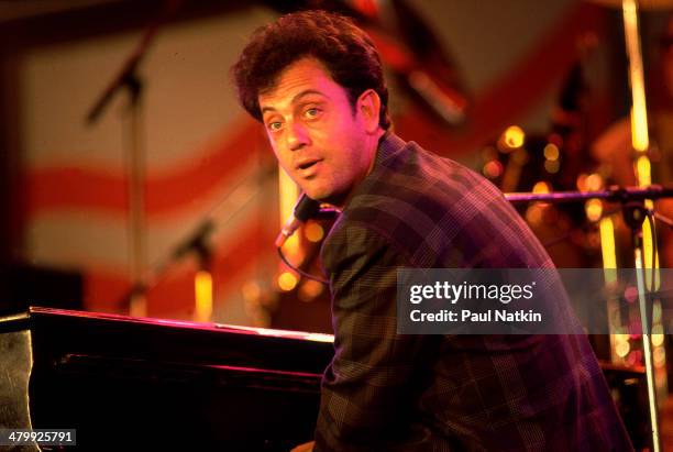 Musician Billy Joel performs onstage during the first Farm Aid benefit concert at Memorial Stadium, Champaign, Illinois, September 22, 1985.
