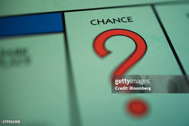 The "Chance" square is seen on a Hasbro Inc. Monopoly board game arranged for a photograph taken with a tilt-shift lens in Oradell, New Jersey, U.S.,...