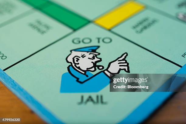 The "Go To Jail" square is seen on a Hasbro Inc. Monopoly board game arranged for a photograph taken with a tilt-shift lens in Oradell, New Jersey,...