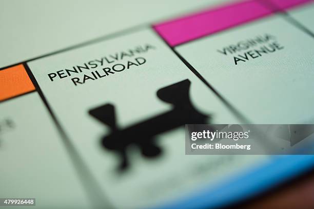 The "Pennsylvania Railroad" station square is seen on a Hasbro Inc. Monopoly board game arranged for a photograph taken with a tilt-shift lens in...