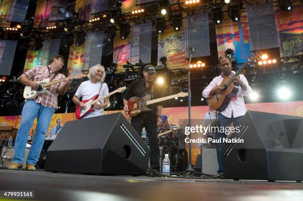 From left, musicians Vince Gill, Albert Lee, James Burton, and Earl Klugh perform onstage at Eric Clapton's Crossroads Guitar Festival, held at...