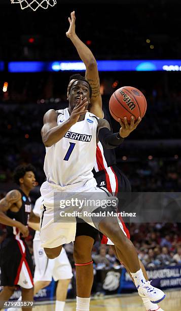 Austin Chatman of the Creighton Bluejays drives to the basket against Louisiana Lafayette Ragin Cajuns in the first half during the second round of...