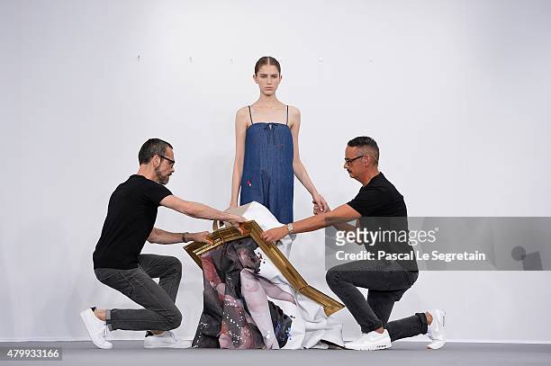 Viktor Horsting, a model and Rolf Snoeren pose on the runway during the Viktor & Rolf show as part of Paris Fashion Week Haute Couture Fall/Winter...