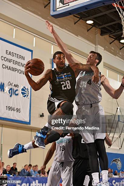 Glen Rice Jr of the Orlando Magic drives to the basket against Frank Kaminsky of the Charlotte Hornets on July 8, 2015 at Amway Center in Orlando,...