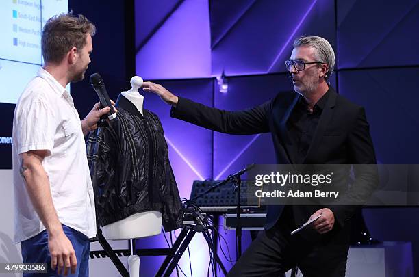Gabriel Platt demonstrates a Distance Control sexual assault jacket with built-in electrical shock for oncoming perpetrators to moderator Robert...