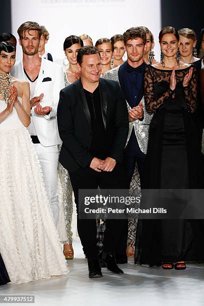 Designer Guido Maria Kretschmer and models pose on the runway after the Guido Maria Kretschmer show during the Mercedes-Benz Fashion Week Berlin...