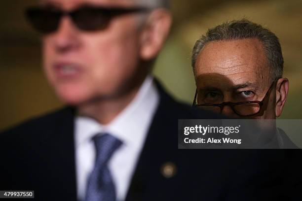 Senate Minority Leader Sen. Harry Reid speaks as Sen. Charles Schumer listens during a news briefing July 8, 2015 at the U.S. Capitol in Washington,...