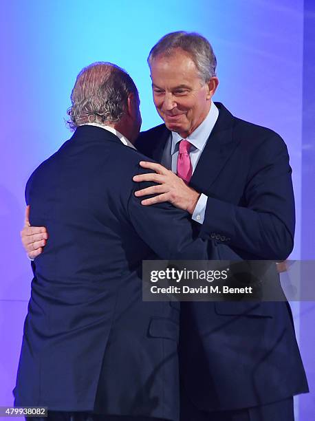 Sir Philip Green greets Tony Blair at the Fashion Retail Academy 10th Anniversary Awards at Freemasons' Hall on July 8, 2015 in London, England.