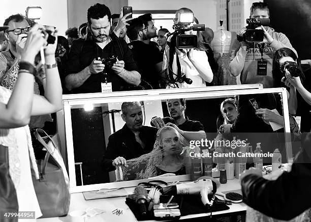 Designer Elie Saab works backstage before his show as part of Paris Fashion Week Haute Couture Fall/Winter 2015/2016 on July 8, 2015 in Paris, France.