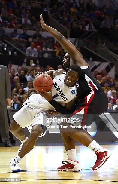 Austin Chatman of the Creighton Bluejays drives to the basket against Xavian Rimmer of the Louisiana Lafayette Ragin Cajuns in the second half during...